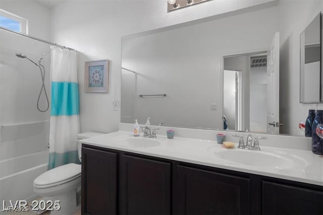 bathroom with double vanity, a sink, toilet, and shower / tub combo with curtain