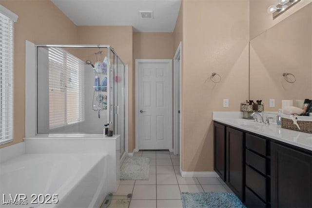 bathroom with tile patterned flooring, a garden tub, vanity, visible vents, and a shower stall