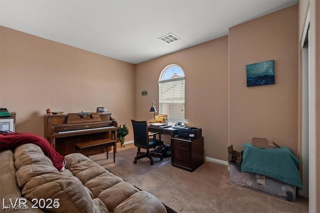 home office featuring carpet, visible vents, and baseboards