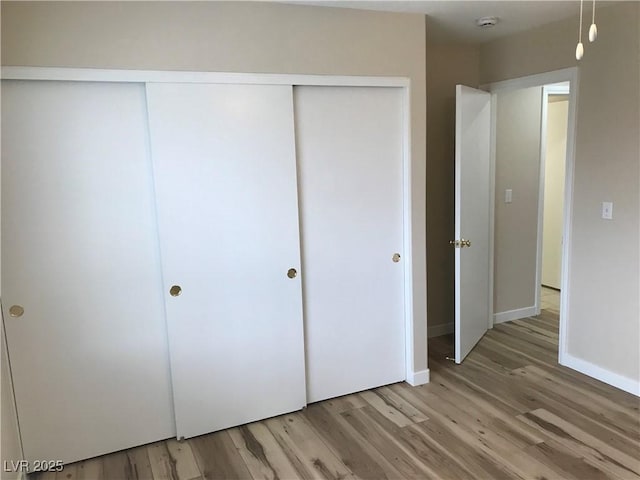 331 Mount Hope St, Henderson, NV 89014 - unfurnished bedroom featuring light wood-style flooring and a closet