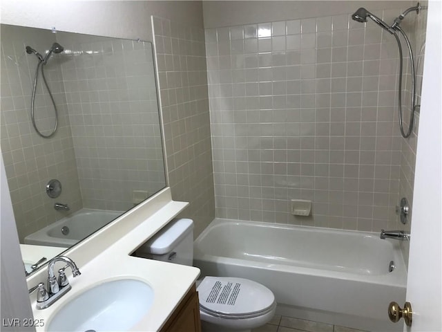 bathroom with toilet, tile patterned flooring, vanity, and bathing tub / shower combination