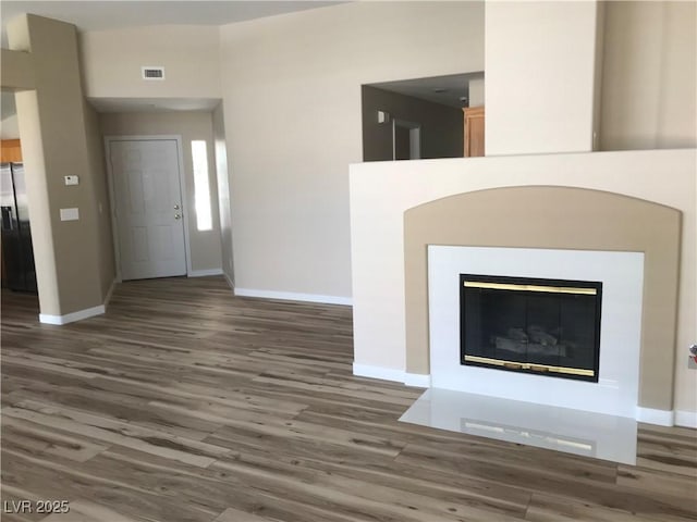 331 Mount Hope St, Henderson, NV 89014 - foyer with wood finished floors and a glass covered fireplace