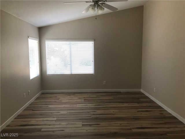 331 Mount Hope St, Henderson, NV 89014 - spare room with ceiling fan, vaulted ceiling, and dark wood-style floors