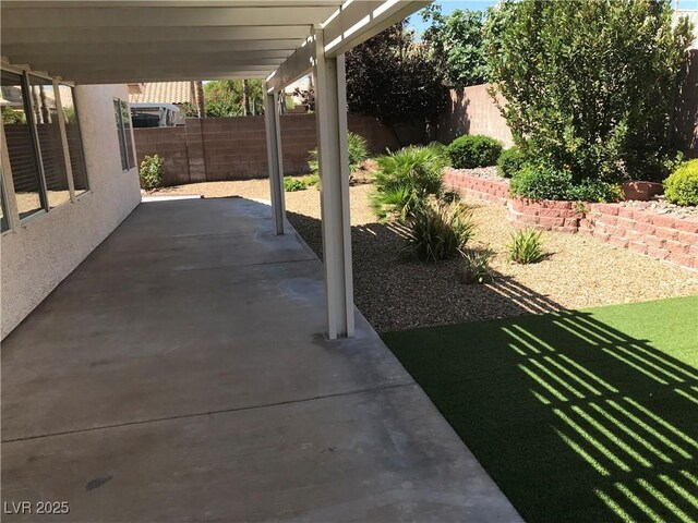 331 Mount Hope St, Henderson, NV 89014 - fenced backyard with a patio area