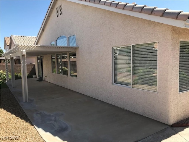 331 Mount Hope St, Henderson, NV 89014 - rear view of property featuring a patio, stucco siding, and a pergola