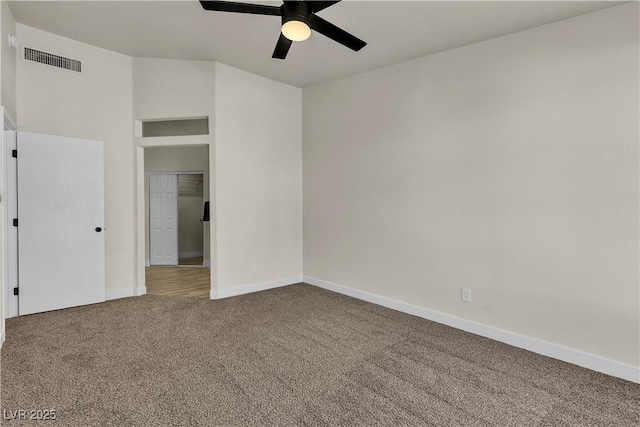 unfurnished bedroom with ceiling fan, carpet floors, visible vents, and baseboards