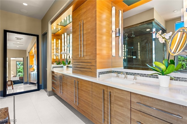 full bathroom with a wealth of natural light, a stall shower, and vanity