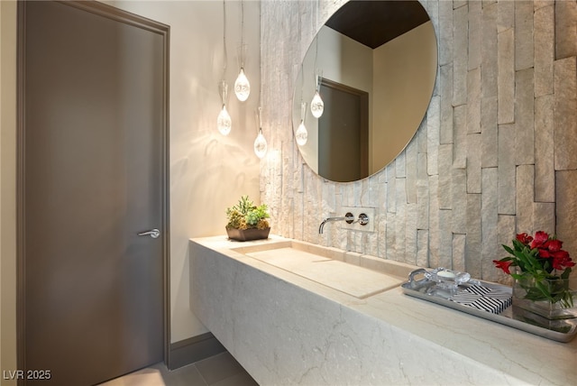 bathroom with tile patterned floors