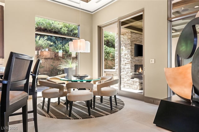 dining space featuring a fireplace