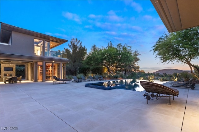 outdoor pool featuring a patio