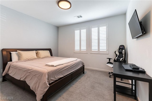 carpeted bedroom featuring visible vents and baseboards