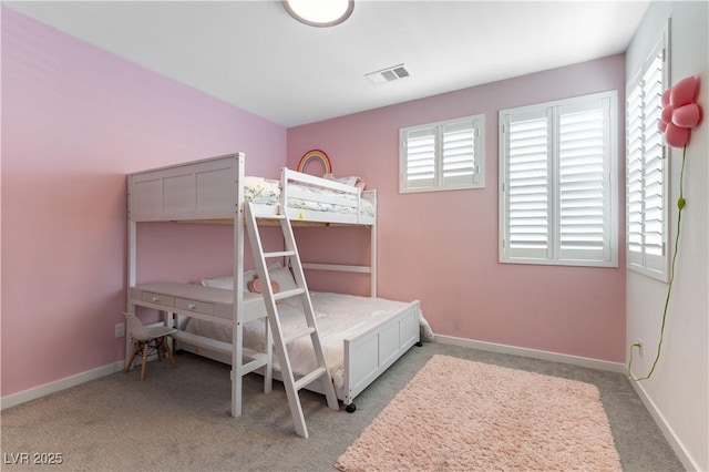 bedroom featuring light carpet, visible vents, and baseboards