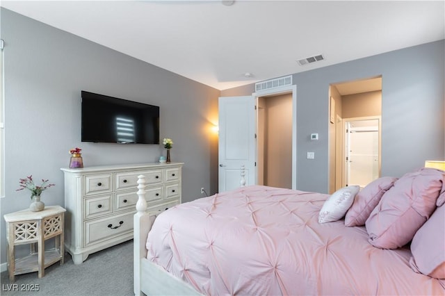 bedroom with visible vents and light carpet