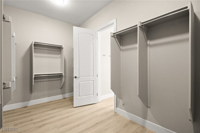 walk in closet featuring light wood-type flooring