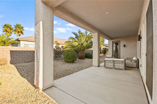 view of patio / terrace featuring a fenced backyard and an outdoor living space