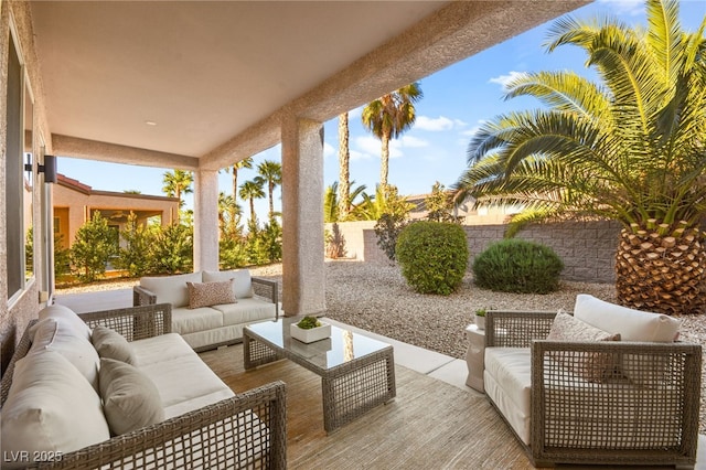 view of patio / terrace featuring fence and an outdoor living space