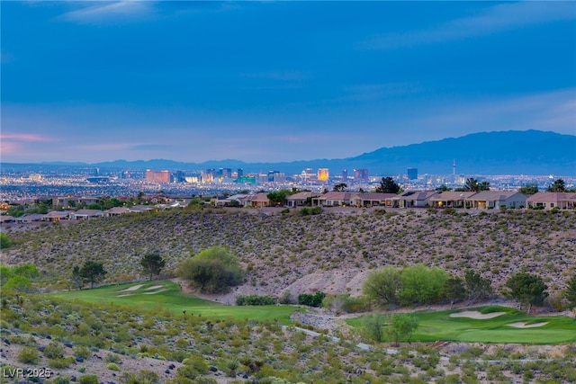 property view of mountains featuring view of golf course