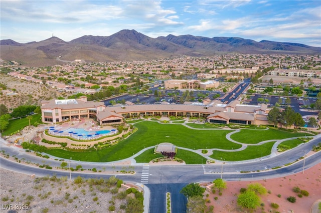 birds eye view of property with a mountain view