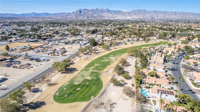 aerial view with a residential view, a mountain view, and golf course view