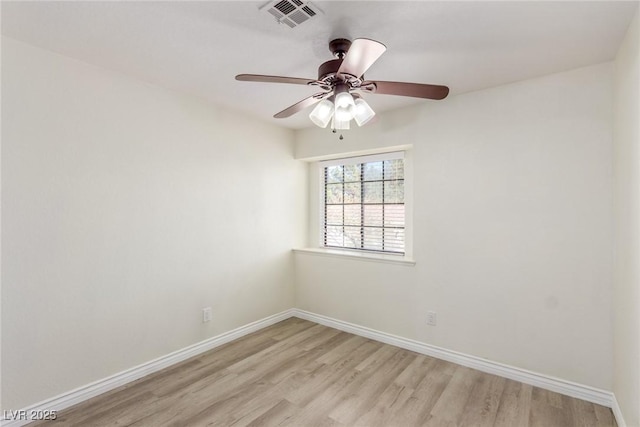 unfurnished room featuring a ceiling fan, light wood-type flooring, visible vents, and baseboards