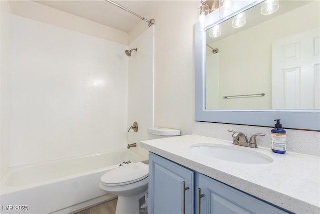 bathroom featuring  shower combination, wood finished floors, vanity, and toilet