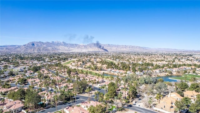 drone / aerial view featuring a residential view and a water and mountain view