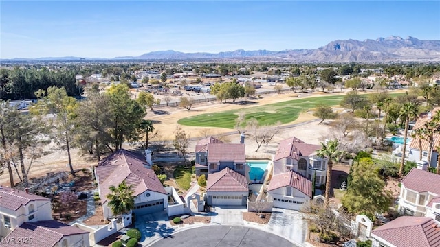 bird's eye view featuring a mountain view and golf course view