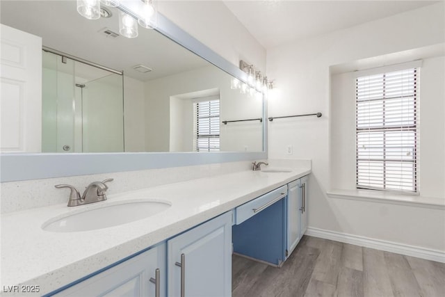 full bathroom with plenty of natural light, visible vents, and a sink