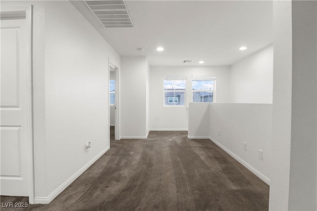 interior space with recessed lighting, visible vents, and baseboards