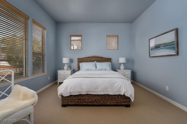 bedroom featuring carpet floors and baseboards