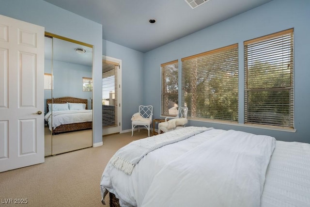 bedroom with visible vents, baseboards, and carpet flooring