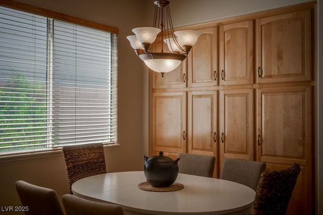 dining area with a chandelier