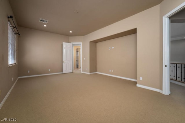 unfurnished bedroom featuring recessed lighting, carpet flooring, visible vents, and baseboards