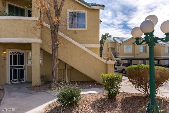 view of side of property with stucco siding