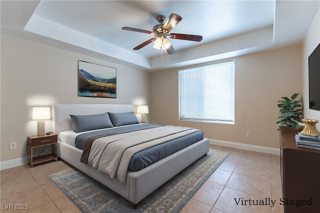 1560 Jamielinn Ln Unit 101, Las Vegas, NV 89110 - bedroom featuring a raised ceiling, light tile patterned floors, baseboards, and a ceiling fan