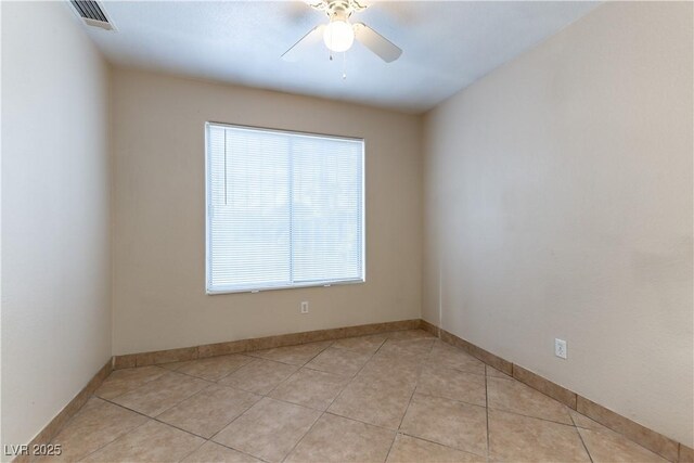 1560 Jamielinn Ln Unit 101, Las Vegas, NV 89110 - empty room featuring ceiling fan, light tile patterned floors, and baseboards