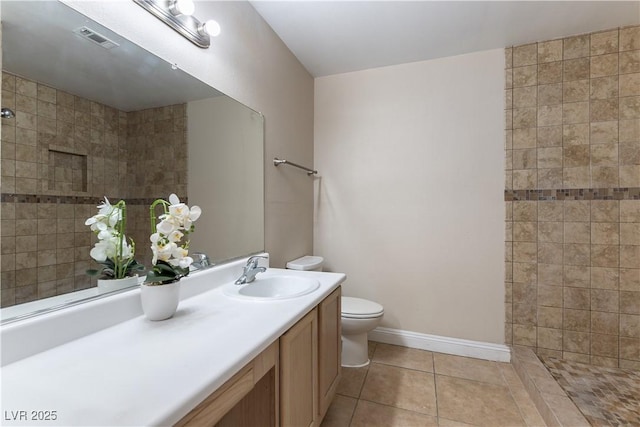 full bath with visible vents, toilet, tile patterned flooring, a tile shower, and vanity