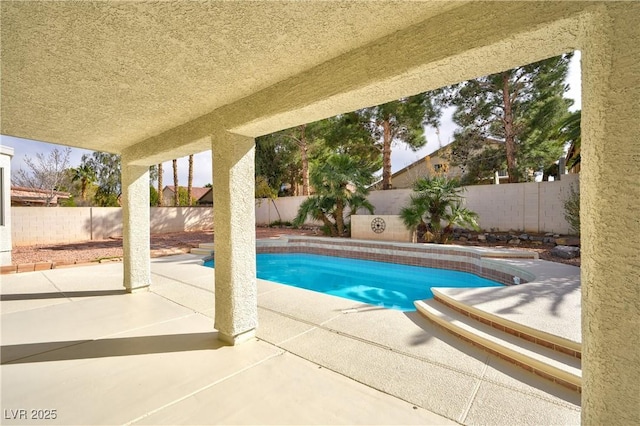 view of swimming pool featuring a patio, a fenced backyard, and a fenced in pool