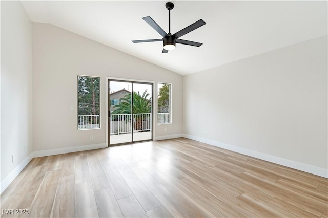 unfurnished room with lofted ceiling, light wood-style flooring, baseboards, and ceiling fan