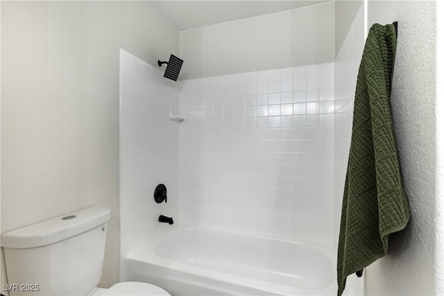 bathroom with toilet and shower / bath combination