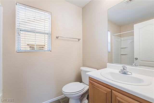 full bath featuring a shower, vanity, and toilet