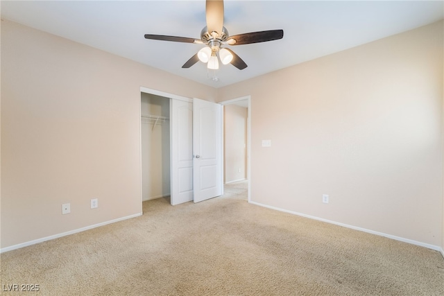 unfurnished bedroom with baseboards, a closet, and light colored carpet