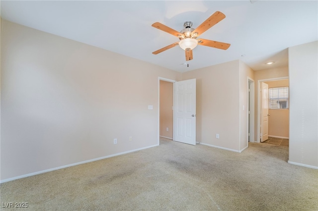 unfurnished bedroom with a ceiling fan, carpet flooring, and baseboards