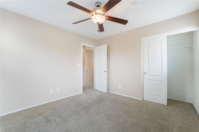 unfurnished bedroom with a closet, carpet flooring, a ceiling fan, and baseboards