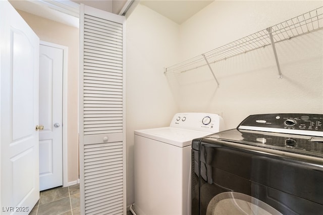 clothes washing area featuring laundry area and washing machine and dryer