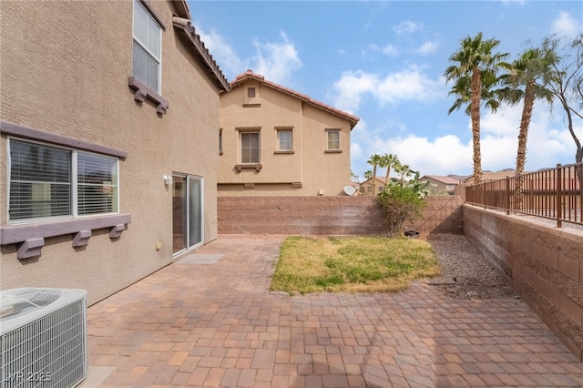 view of patio / terrace featuring central AC unit and a fenced backyard