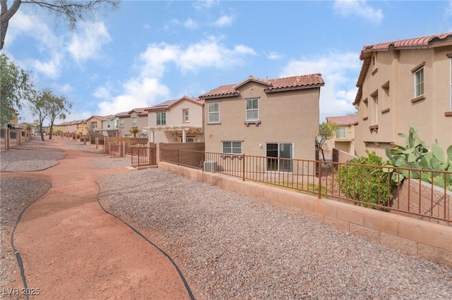 view of community with a residential view and fence