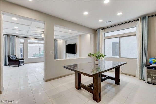 dining area with plenty of natural light, coffered ceiling, visible vents, and recessed lighting