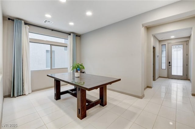 dining room featuring light tile patterned flooring, baseboards, visible vents, and recessed lighting