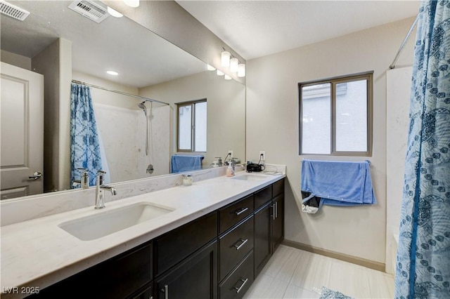 full bath with visible vents, a sink, and double vanity